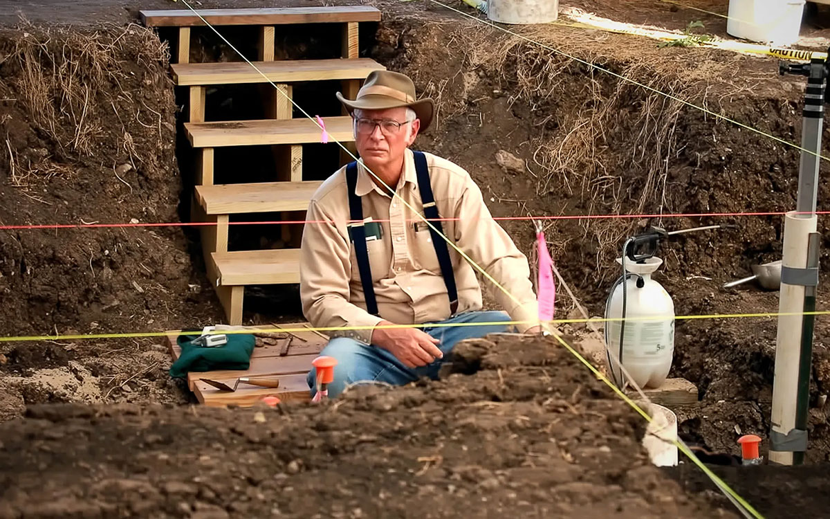Photo of Mike Collins digging at the Gault Site